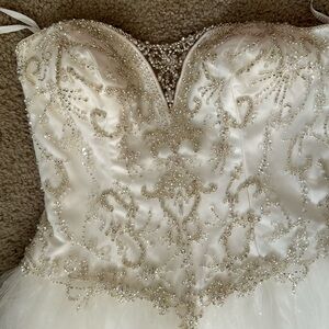 Hello, I am selling this Beautiful gown I have never worn, Tag is still on it.